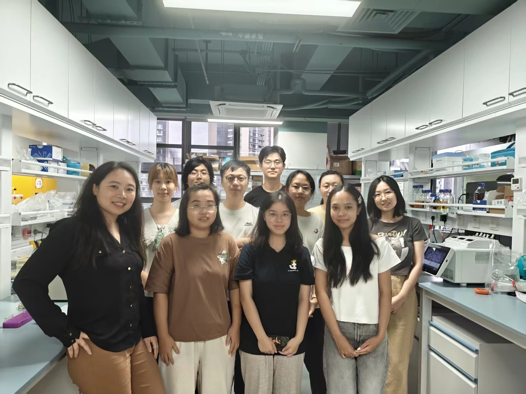 A group photo of lab members and summer students
